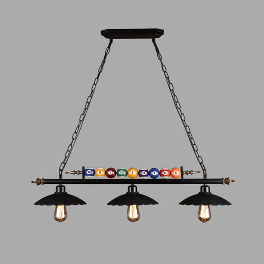 Black industrial metal linear island light with 3-light suspension lamp and colorful billiard balls on central bar