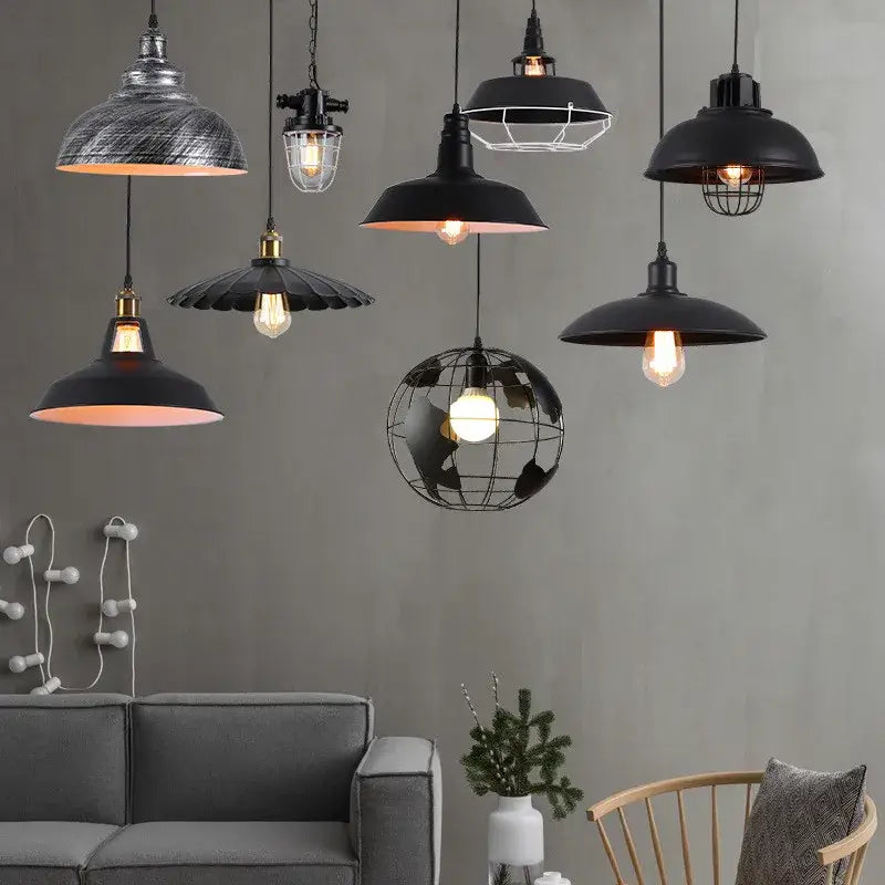 Industrial-style black metal pendant light set with globe and wire cage designs decorbites black industrial for kitchen island