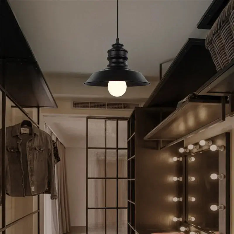 Decorbites black industrial pendant light with matte black rounded bell-shaped shade hanging from slender cord for kitchen island