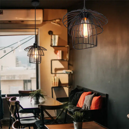Decorbites black iron pendant light with black iron cage and exposed filament bulbs for kitchen or living room use