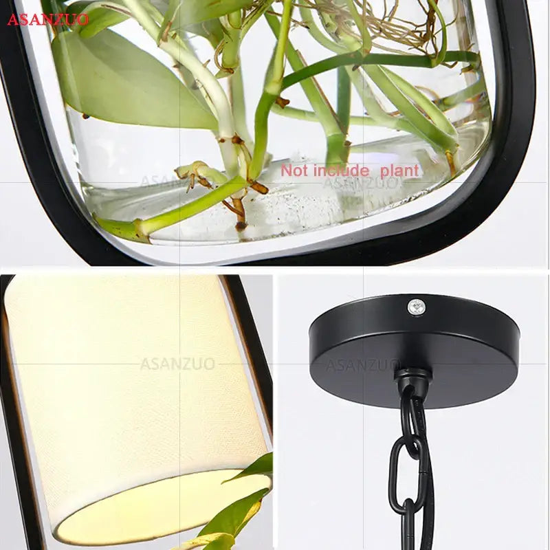 Decorbites black iron cage pendant light with black-framed glass shade and green plant stems suspended by metal chain