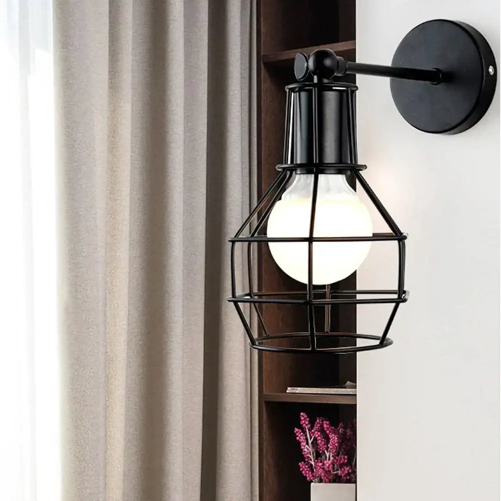 DecorBites black iron cage wall lamp with glowing bulb retro indoor sconce for bedroom bar and reading