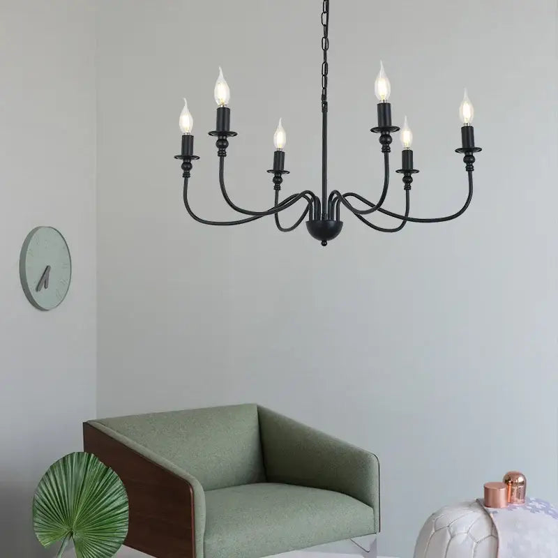 DecorBites black iron chandelier with six LED candle light bulbs in black wrought iron for home and hospitality