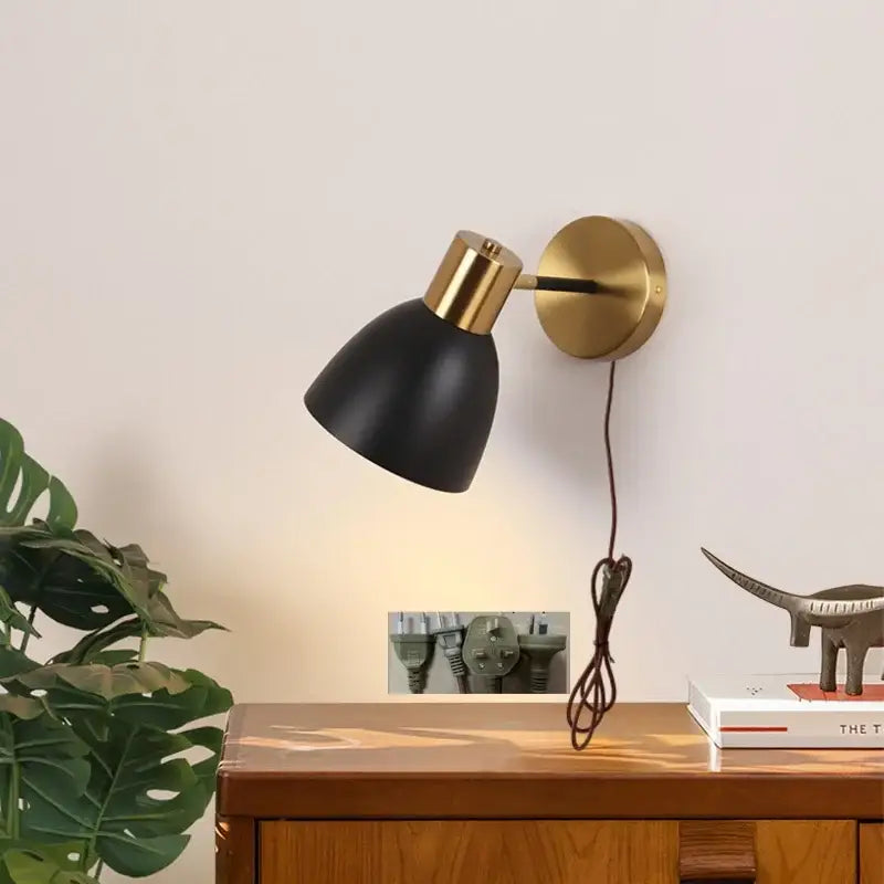 Decorbites black iron wall sconce with black matte finish brass accent and adjustable arm for modern vanity lighting
