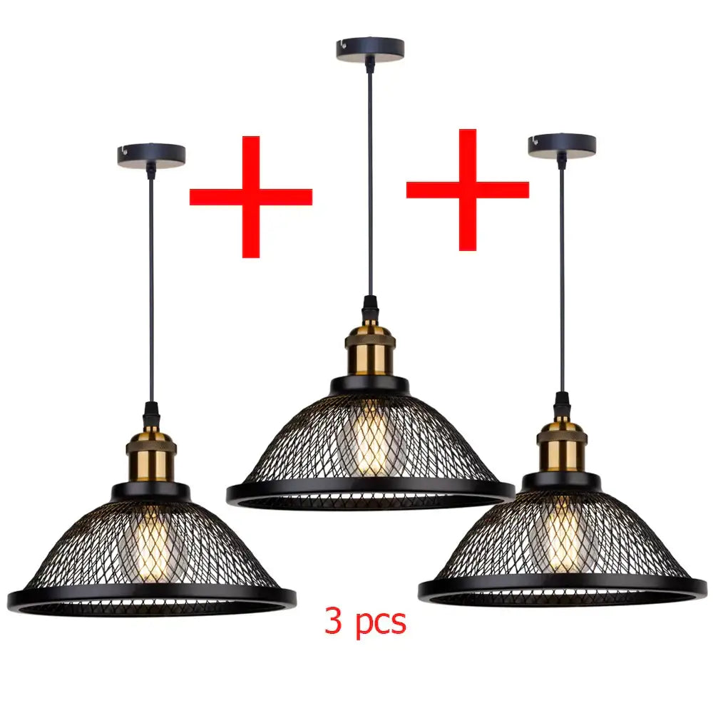 Set of three black iron pendant light fixtures with brass accents and wire mesh shades for kitchen or living room