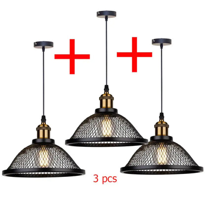 Set of three black iron pendant light fixtures with brass accents and wire mesh shades for kitchen or living room