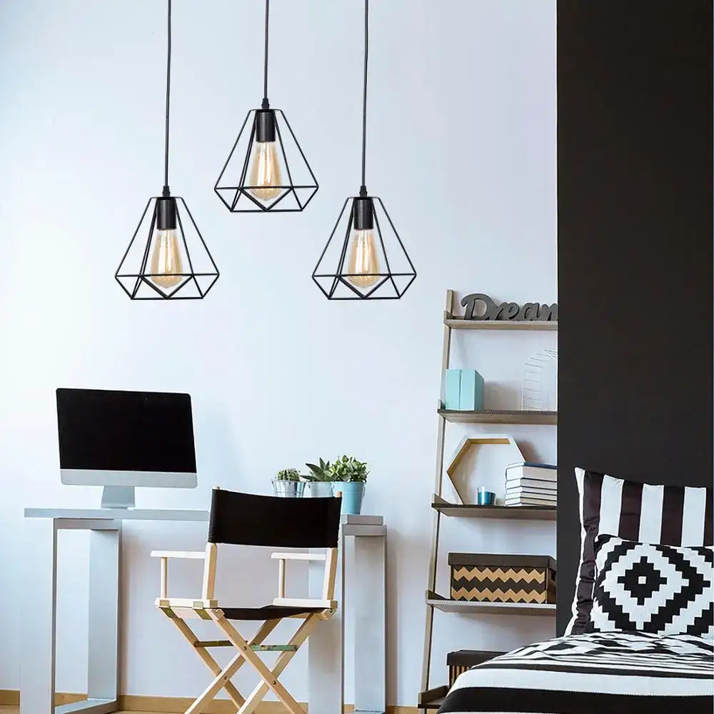 Three black geometric decorbites black iron pendant lights with exposed filament bulbs for kitchen or living room