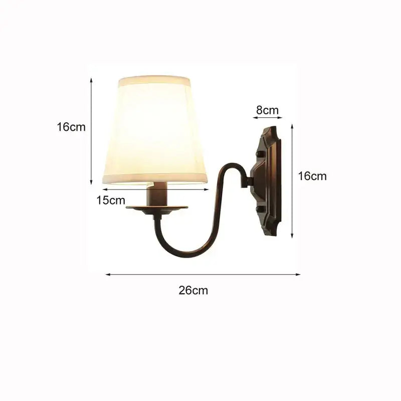 Antique bronze-finished decorbites black iron wall lamp with cream fabric shade for elegant rural bedroom and living room