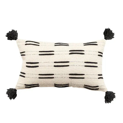 Cream-colored woven cushion cover with black stripes and tassels by decorbites black ivory for living room decor