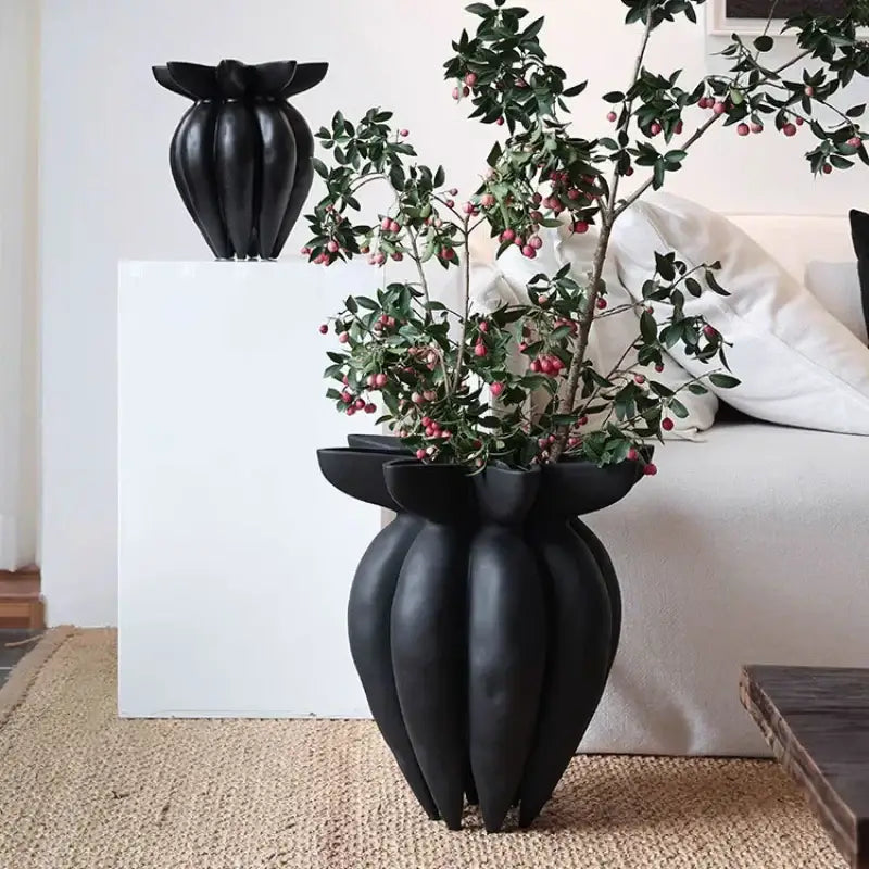 Black ceramic vase with sculpted petal-like design and glossy finish from decorbites black jellyfish petal collection