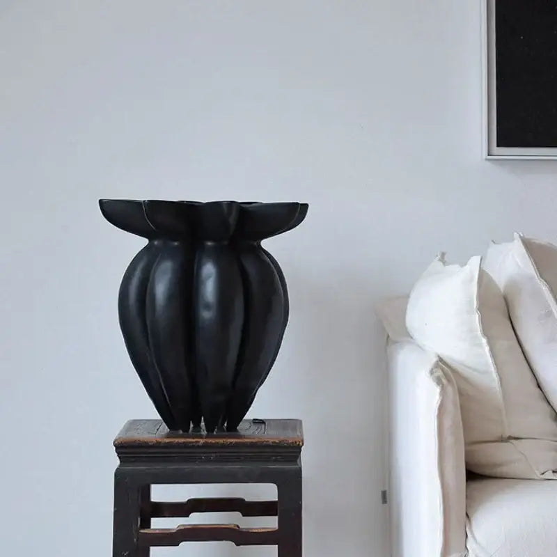 Black jellyfish petal vase by DecorBites features a glossy black ceramic fluted design for artistic home décor