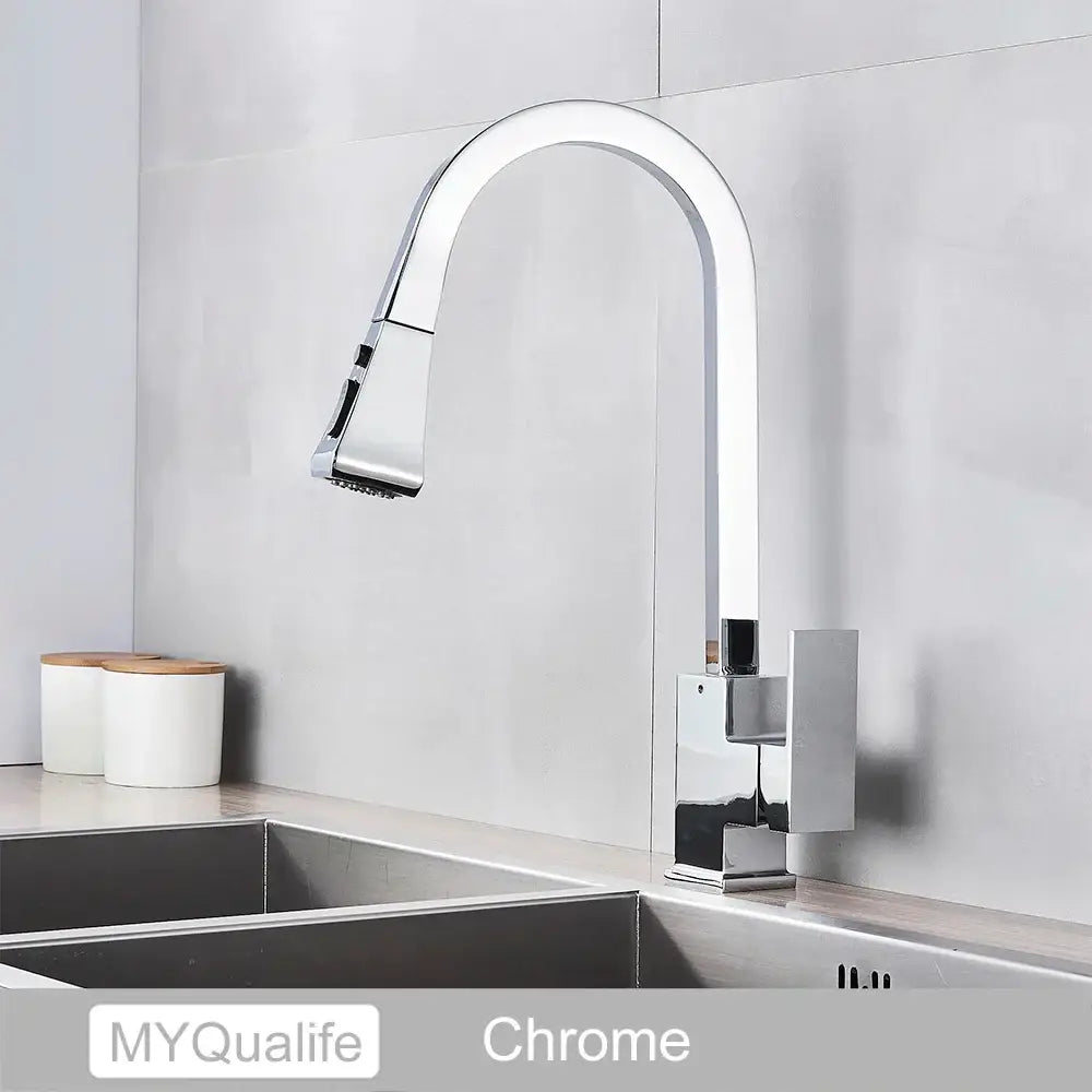 Chrome-finished modern kitchen faucet with sleek arched spout and pull-down spray head in decorbites black kitchen design