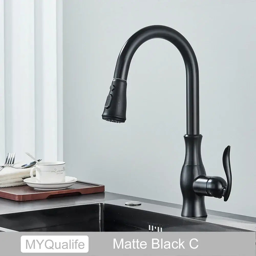 Matte black kitchen faucet by decorbites with a curved spout pull-down spray head and 360 rotation mixer handle