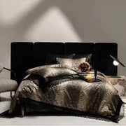 Black velvet headboard with segmented panels complementing DecorBites black lace leopard print bedding set