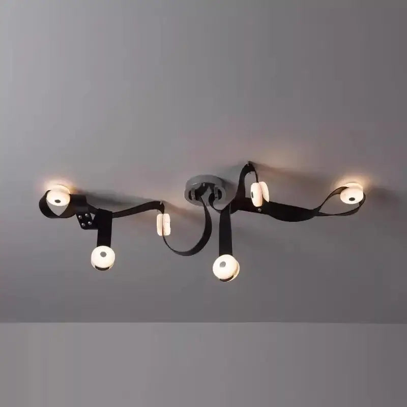 Decorbites black leather marble chandeliers feature a black leather strap ceiling light with four glowing white bulbs