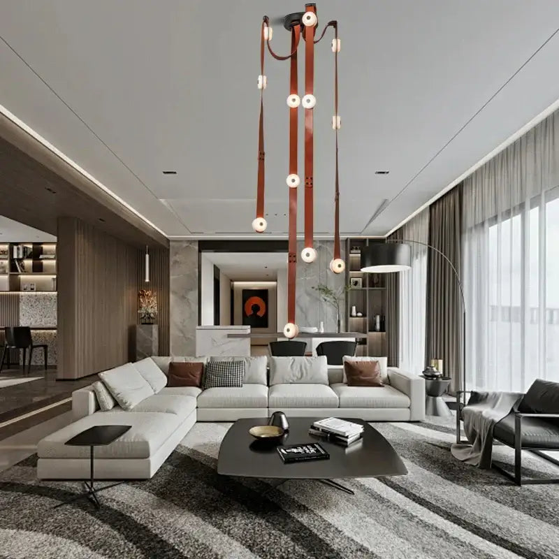 A modern DecorBites black leather marble chandelier with multiple hanging leather straps and circular light fixtures