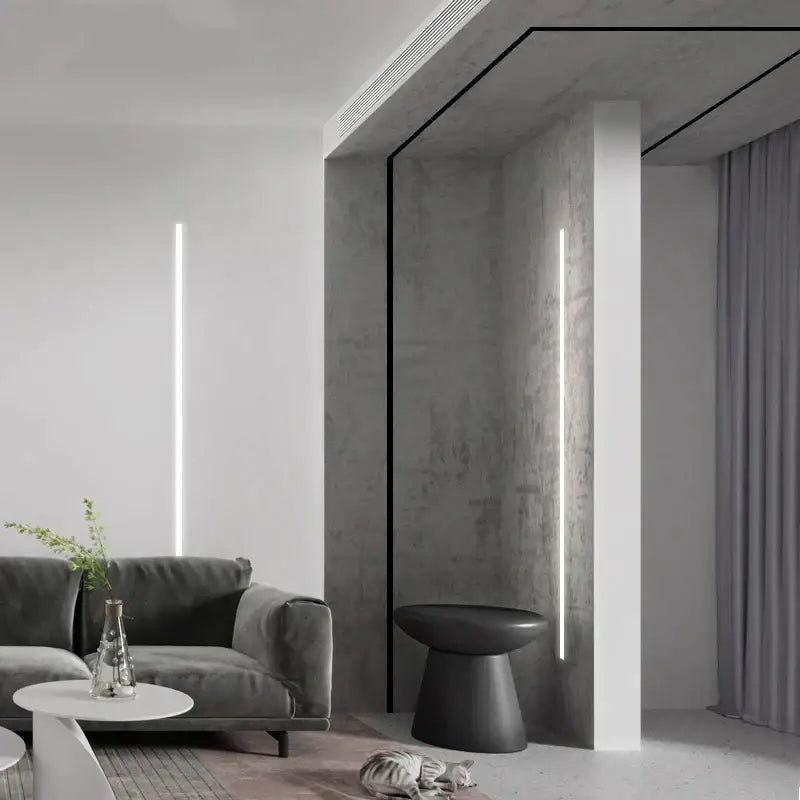 Gray velvet sofa with sleek modern design and minimalist armrests paired with decorbites black led aluminum profile for invisible ceiling light strip bar