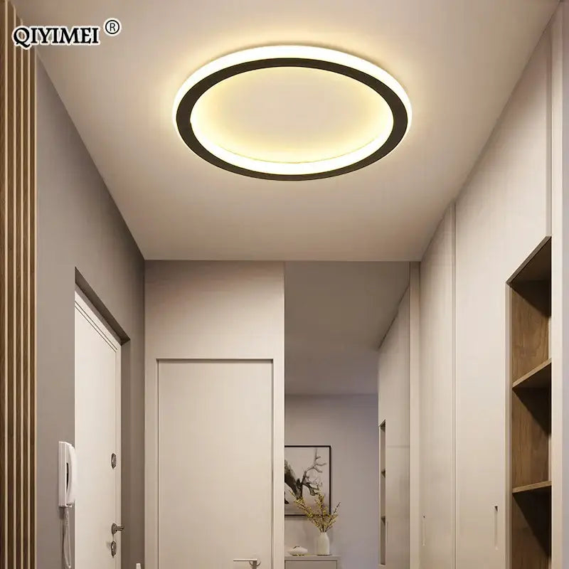 Modern circular decorbites black led ceiling light with sleek black ring and warm white glow for indoor entryway use