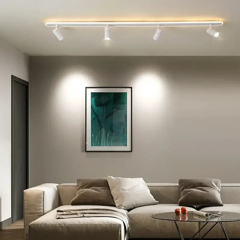 Modern white decorbites black led ceiling spotlights with four adjustable track lights above a beige sofa