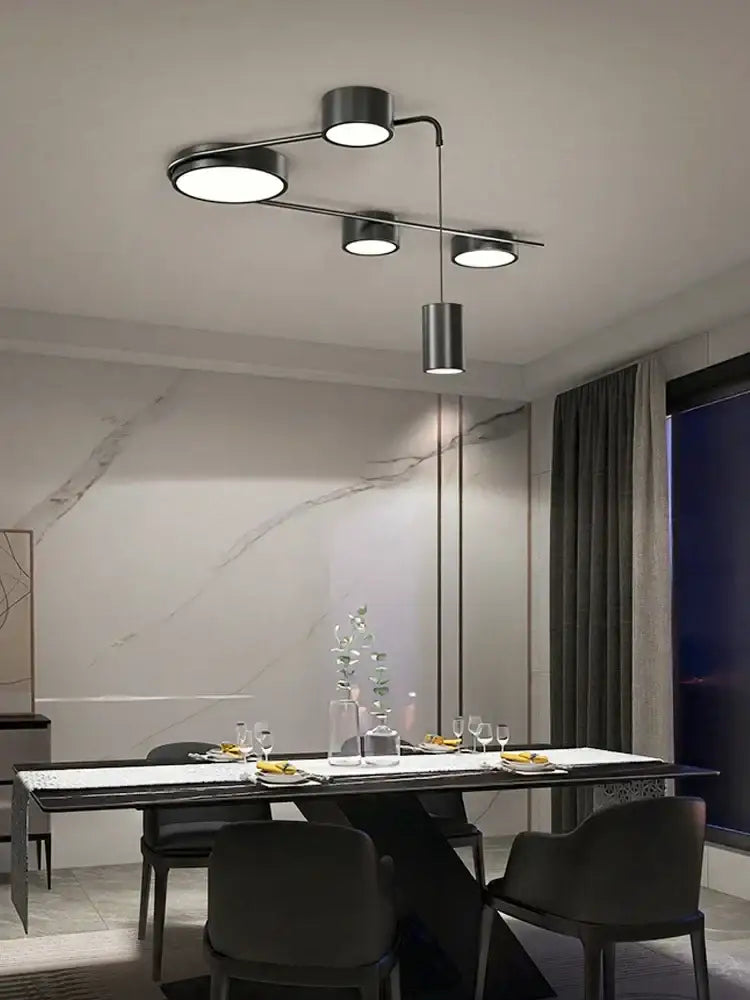 Modern black metal ceiling light fixture with four circular bulbs in decorbites black led chandelier design for indoor use