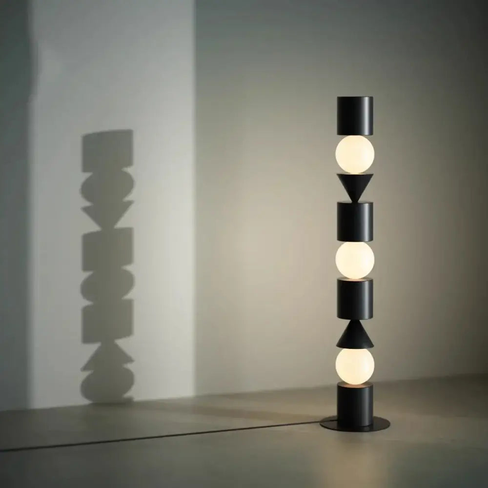 DecorBites black led floor lamp with black cylindrical matte geometric shapes and glowing spherical bulbs for home lighting
