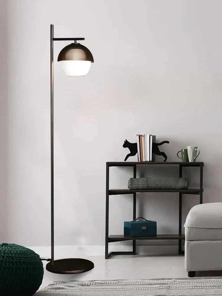 Modern decorbites black led floor lamp with sleek black metal frame and two-toned matte bronze and white dome shade