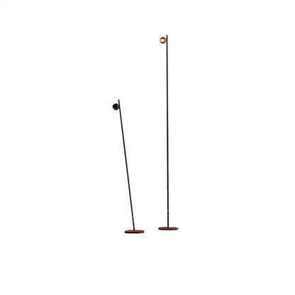 Two decorbites black led floor lamps with slender black metal poles and brass-finished globes on wooden bases