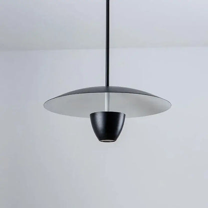 Black led hanging minimalist pendant light by decorbites with sleek disc-shaped shade and conical base for modern spaces