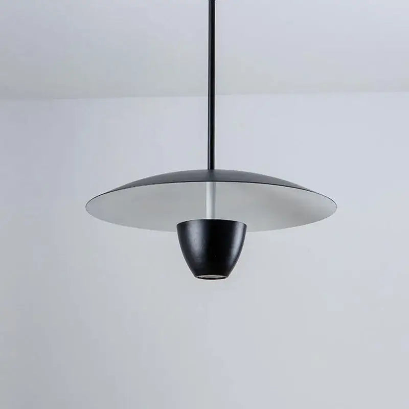 Black led hanging minimalist pendant light by decorbites with sleek disc-shaped shade and conical base for modern spaces