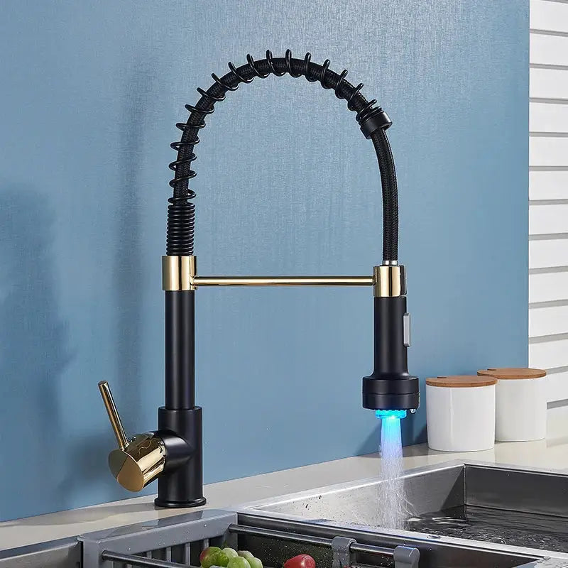 Decorbites black led kitchen faucet with flexible black and gold coiled spout emitting blue light for modern use