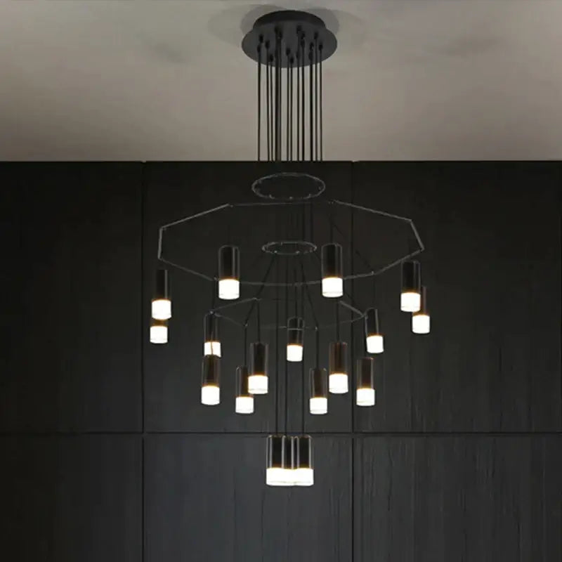Modern black metal decorbites black led linear chandelier with tiered cylindrical led lights for dining room and lobby use