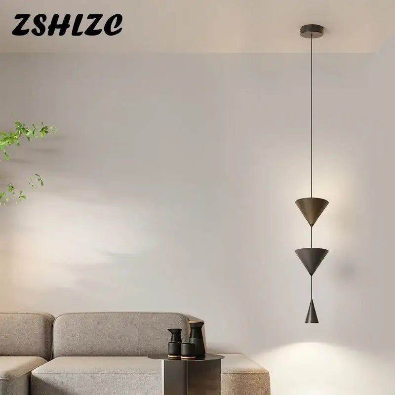 Modern black metal led pendant chandelier with stacked conical shades for nordic home decor by DecorBites
