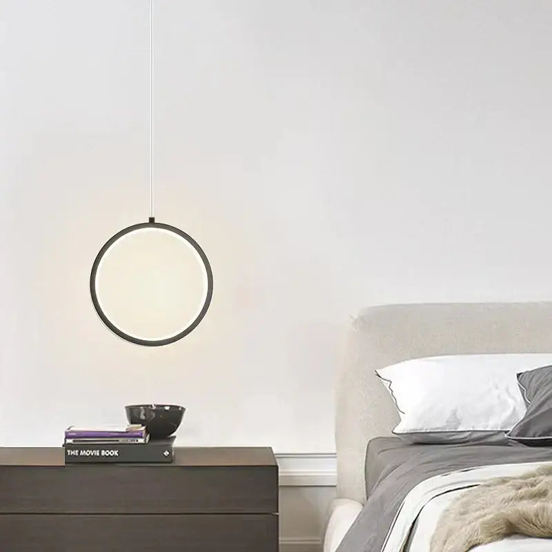Minimalist DecorBites black LED pendant light with sleek black frame and soft diffused glow for elegant bedroom use
