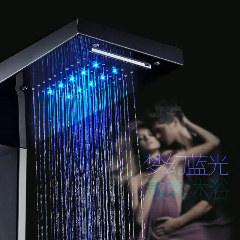 Black led shower panel by DecorBites with blue LED lights illuminating water streams in a sleek black square design