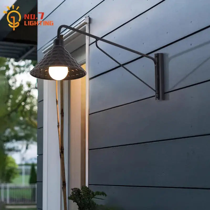Dark bronze decorbites black led wall lamp with textured conical shade and articulated swing arm for indoor outdoor use