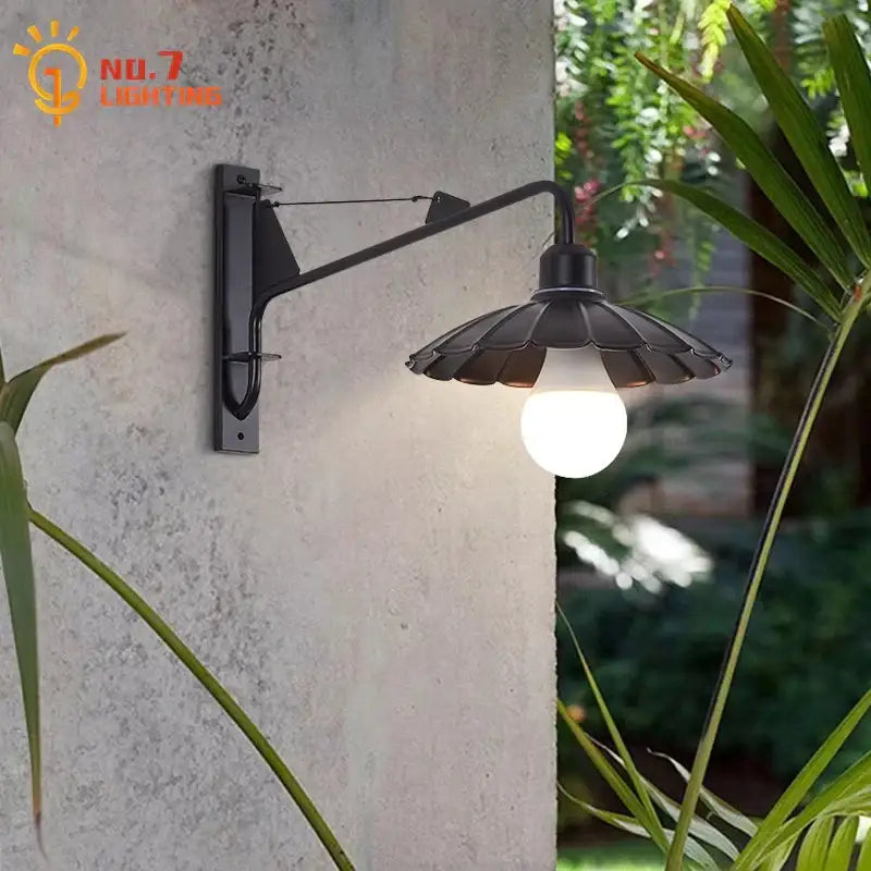 Decorbites black led swing arm wall lamp in wrought iron with fluted petal shade and exposed bulb for outdoor use