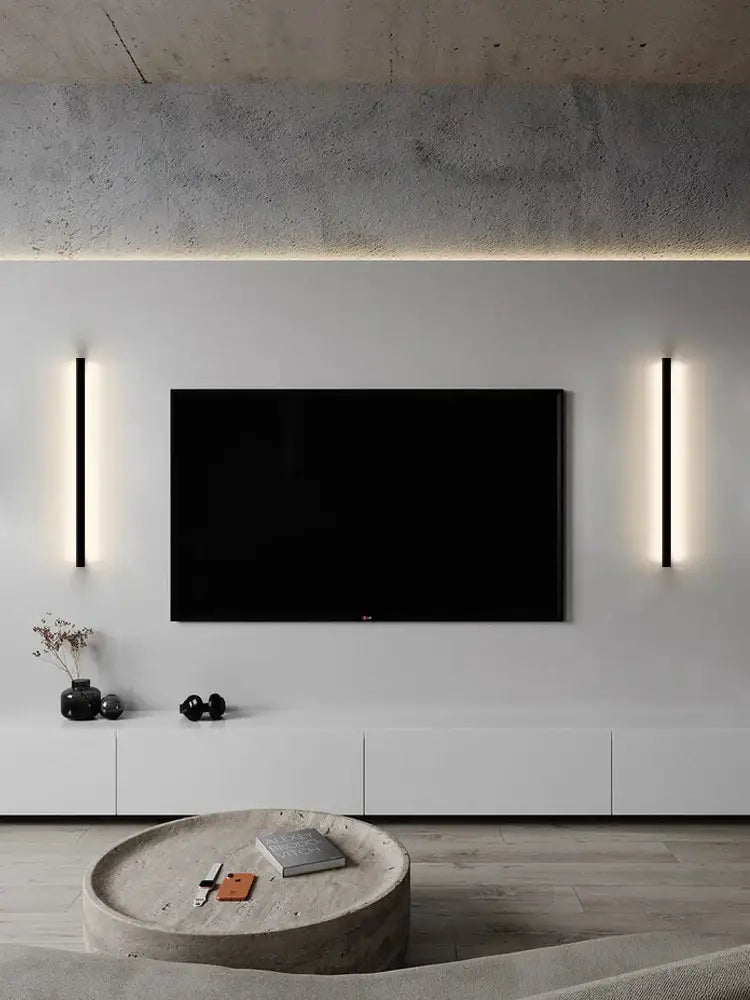 Black flat-screen tv mounted on white wall flanked by decorbites black led wall lamps for bedroom living room use