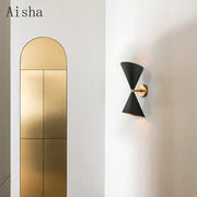 Black conical wall lamp with gold-toned central arm by DecorBites black led for modern home lighting