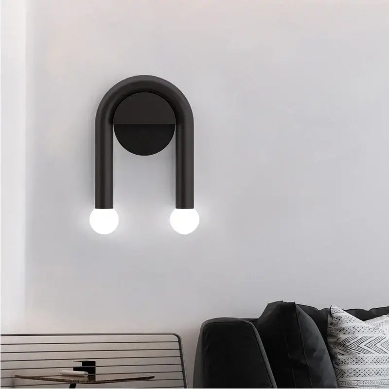 Black u-shaped wall lamp with two glowing spherical bulbs decorbites black led wall modern Nordic indoor sconce