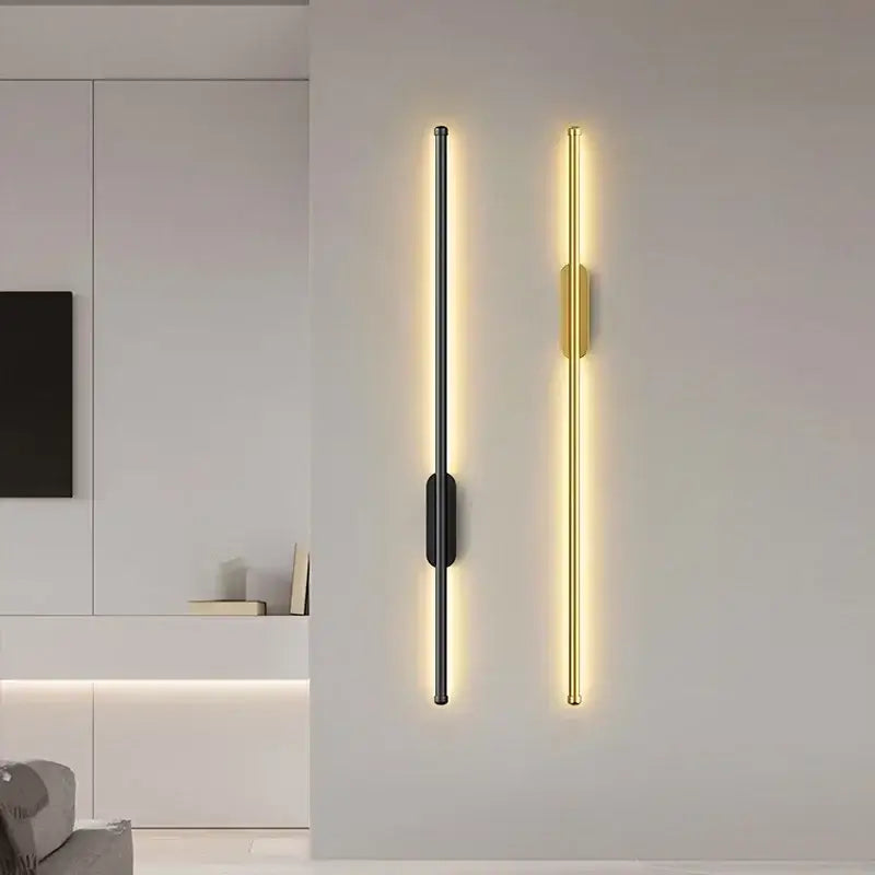 DecorBites™ black and gold led wall lights with sleek vertical strips emit warm ambient light for modern interiors