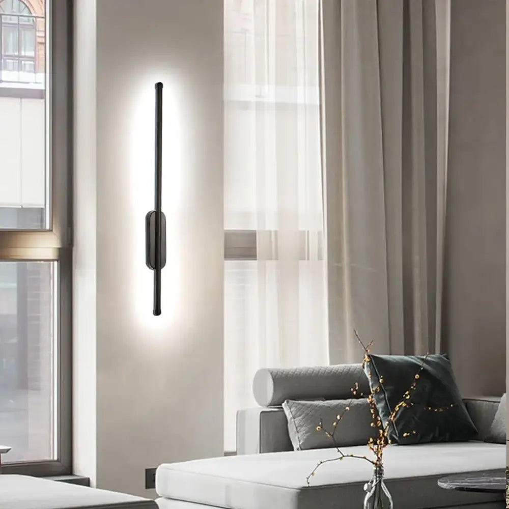 Modern black led wall sconce by DecorBites with sleek vertical design and integrated minimalist lighting fixture