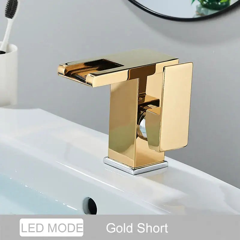 Gold-colored decorbites black led waterfall bathroom faucet with sleek rectangular design and polished metallic finish