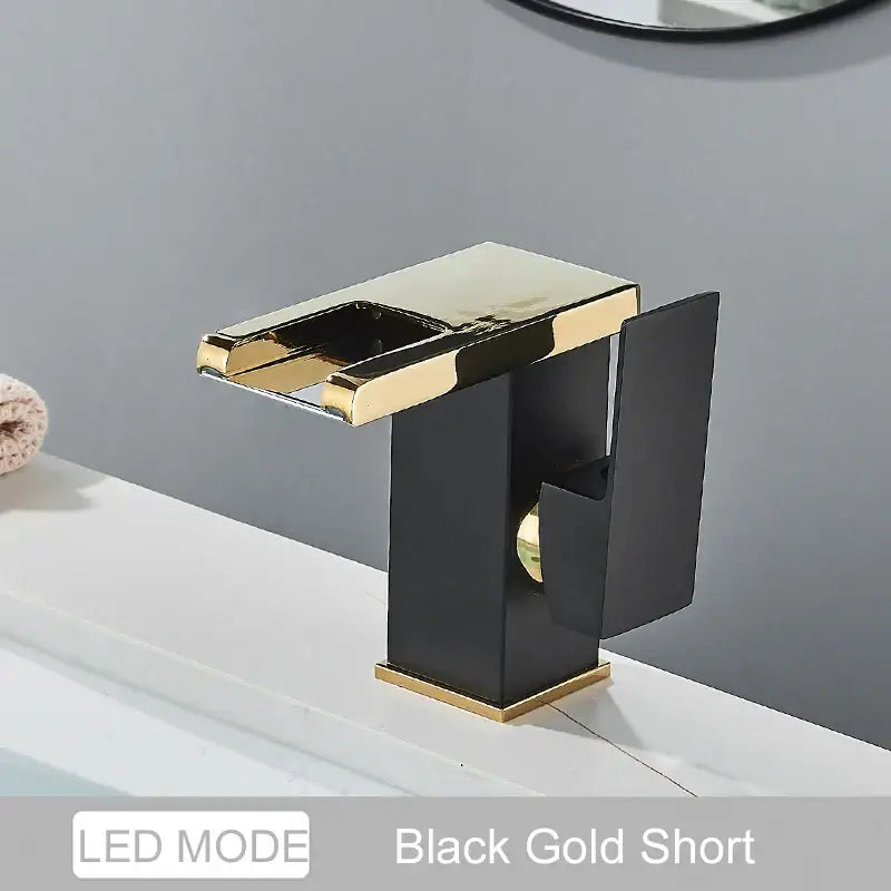 Decorbites black led waterfall bathroom faucet in black and gold with polished metallic finish and three color change led