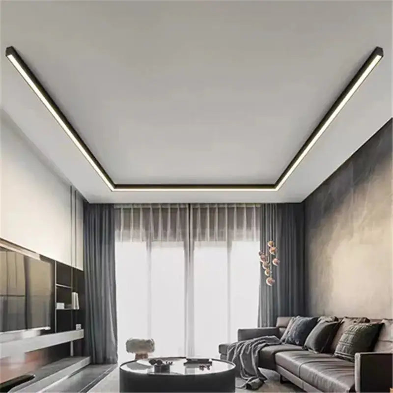Modern recessed ceiling light with sleek black trim and warm white led strip lighting by DecorBites black linear