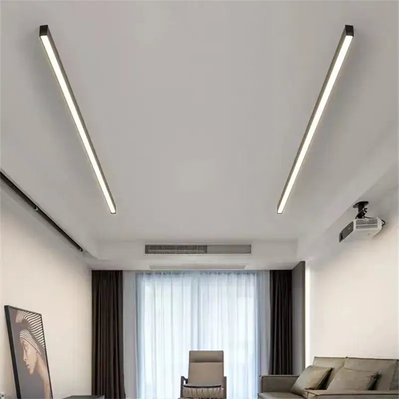 Two sleek decorbites black linear LED ceiling lights with minimalist design and cool white illumination for modern spaces