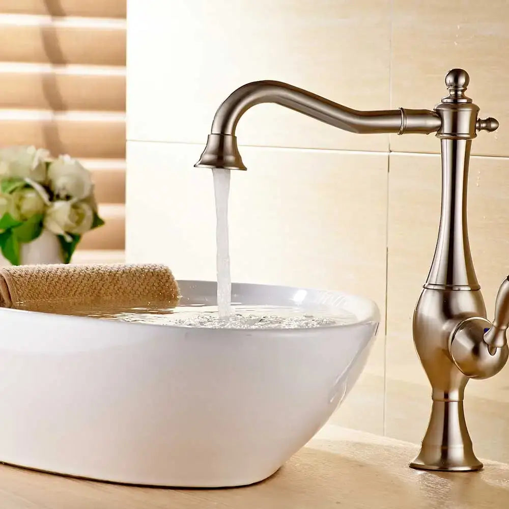 Antique brass-finished single-handle kitchen faucet with curved spout and ornate detailing from decorbites black long neck series
