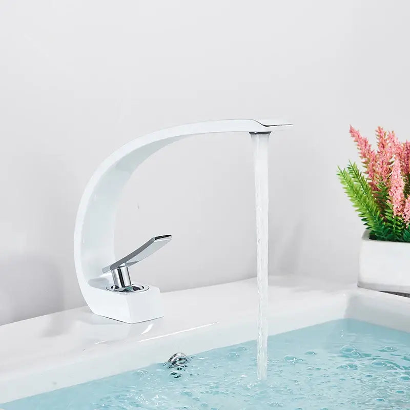 Modern white ceramic basin faucet with sleek curved design and chrome handle in decorbites luxury brass basin faucet