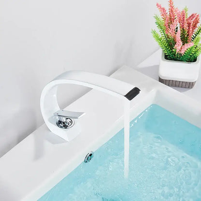 Modern white ceramic basin faucet with sleek curved design and chrome handle for luxury brass basin mixer tap decorbites
