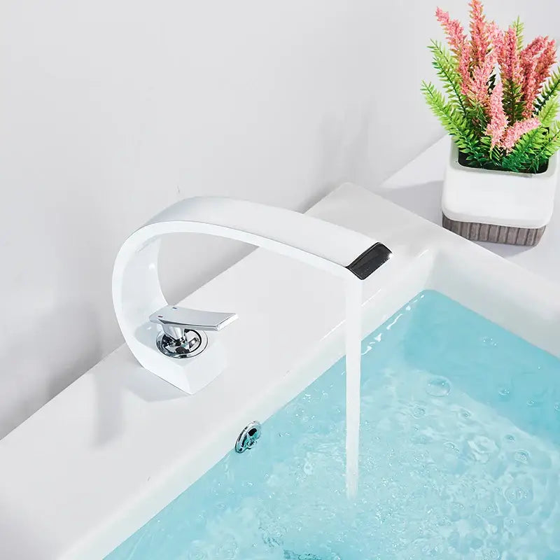 Modern white ceramic basin faucet with sleek curved design and chrome handle for luxury brass basin mixer tap decorbites