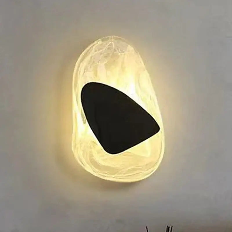 Warm translucent glass decorbites black luxury wall light with smooth organic shape and black luxury led accent